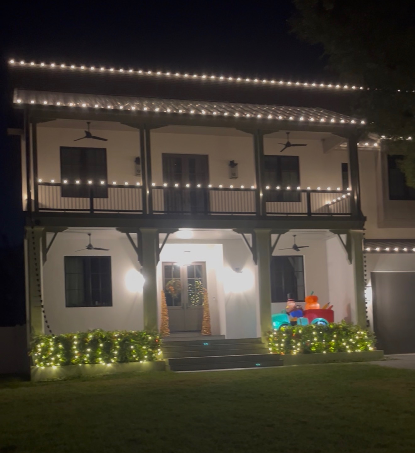 Finished holiday light display on a Palm Harbor home at night